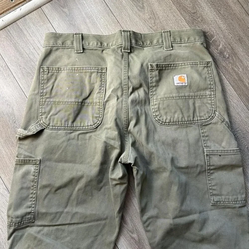Distressed Carhartt relaxed fit olive green pants some staining  Size 34 x 34
